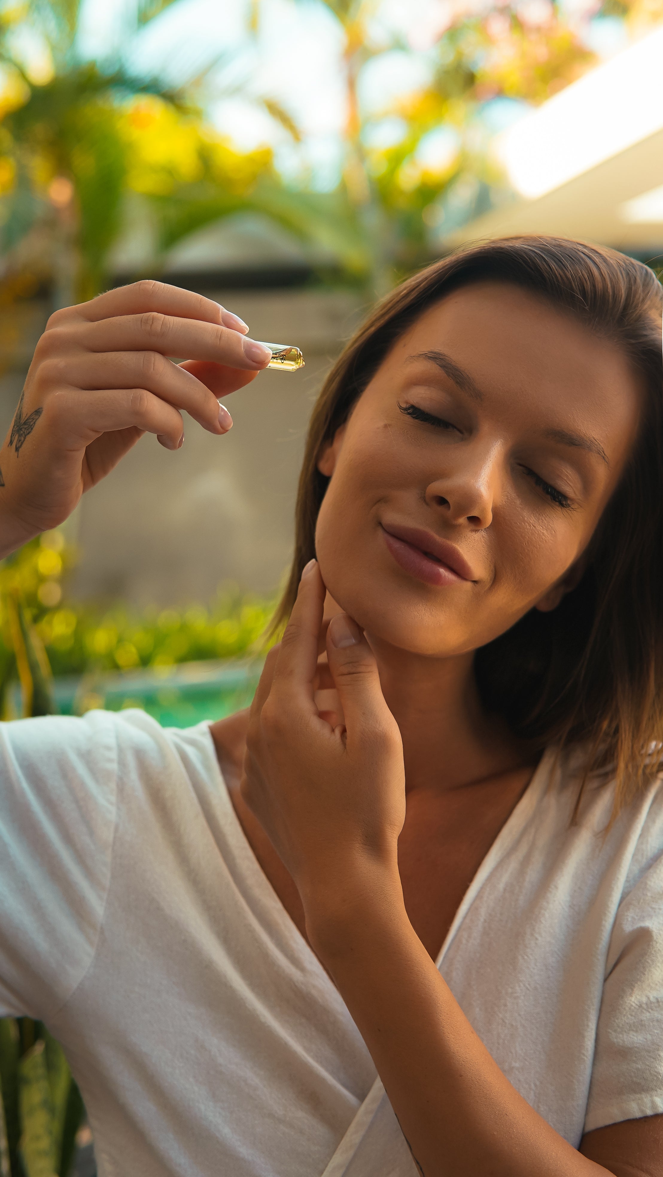 image of a girl using facial serum