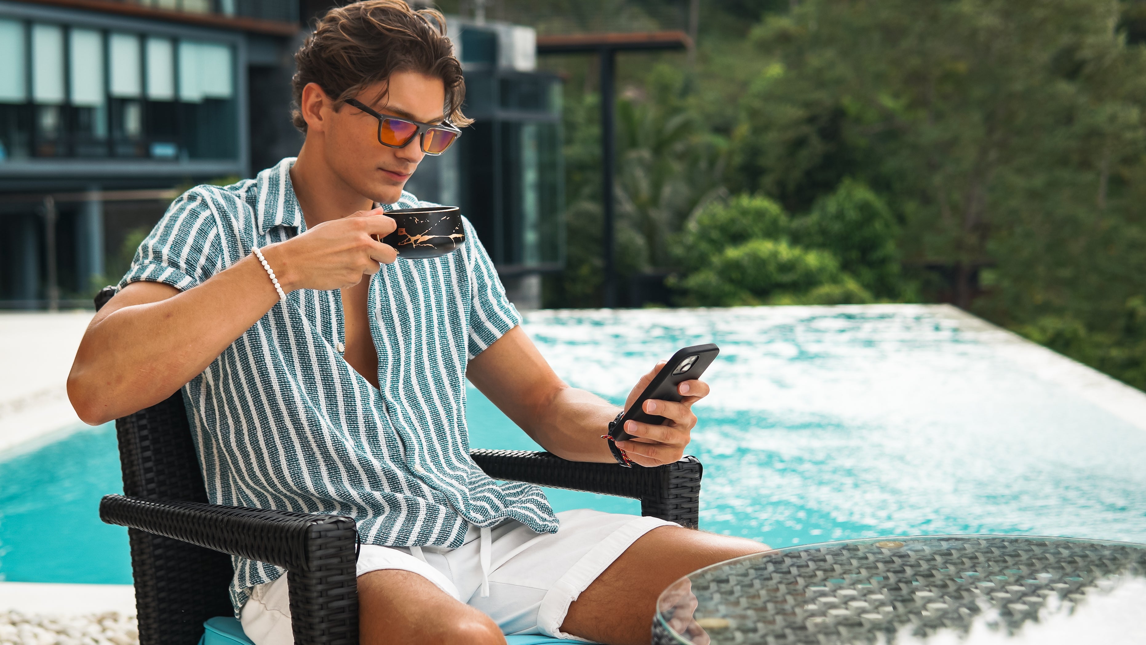 A man is enjoying the tea while wearing EMR-TEK Havoc