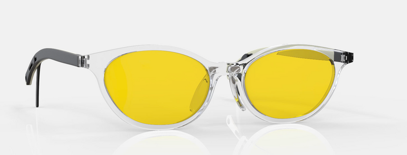 Sunglasses with yellow lenses and clear frames on a white background