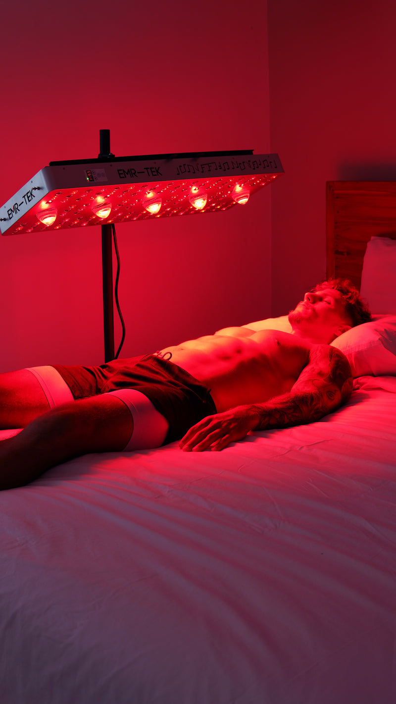 a man lying on bed and using  EMR- TEK inferno 