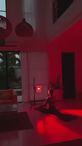a woman using firedragon with the help of light stand of EMR-TEK