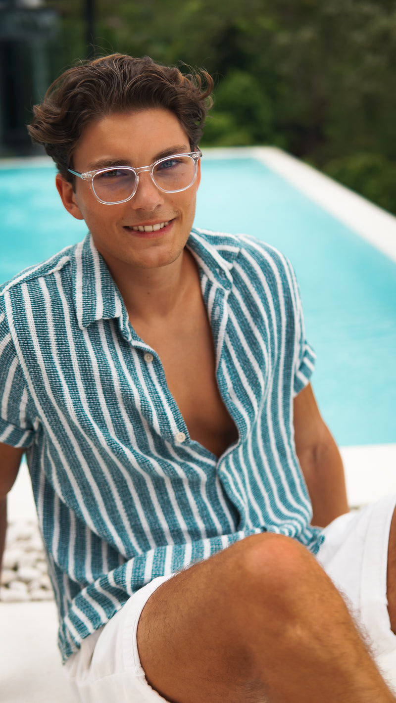 A man smiling and wearing EMR-TEK eyewear